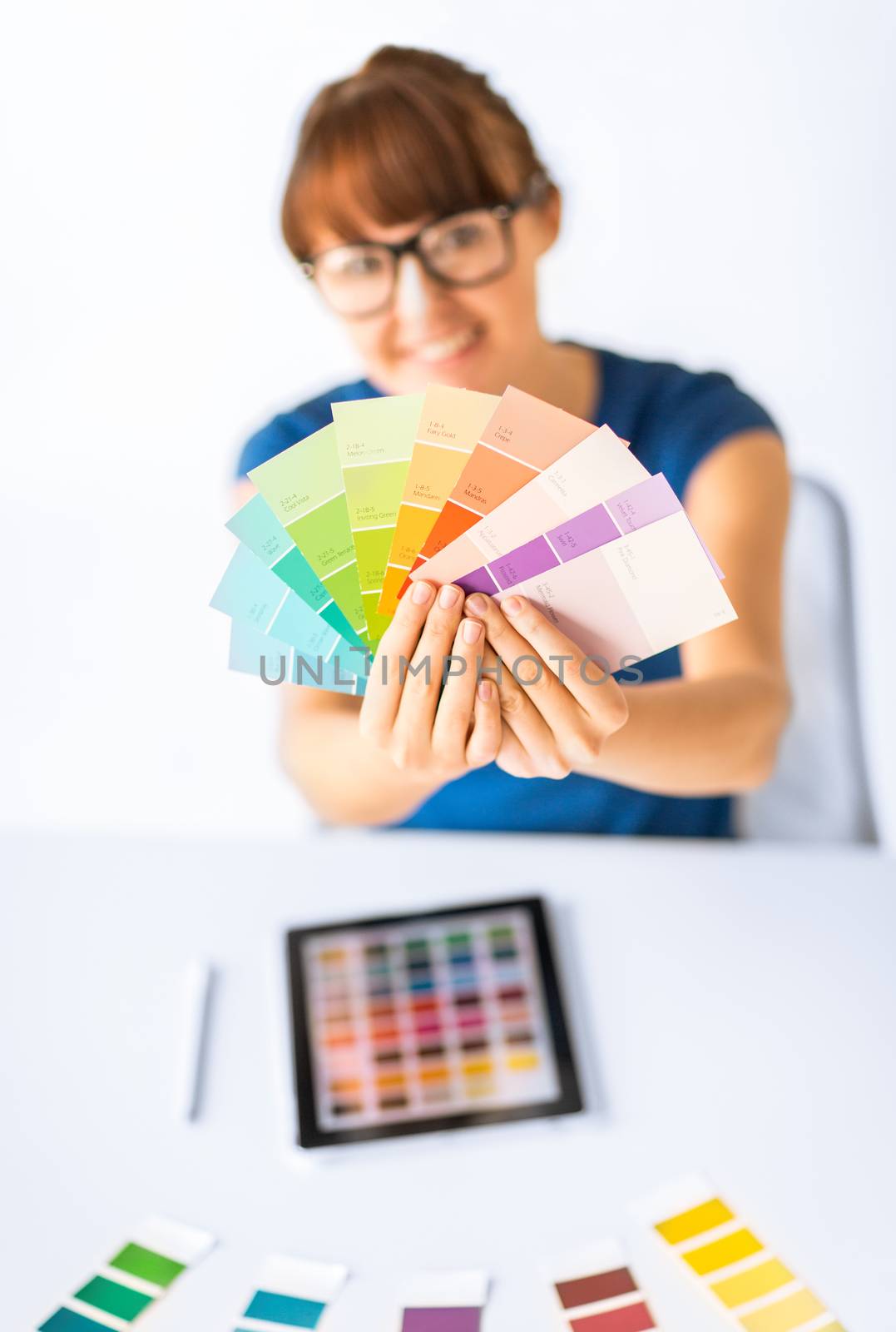 interior design, renovation and technology concept - woman working with color samples for selection