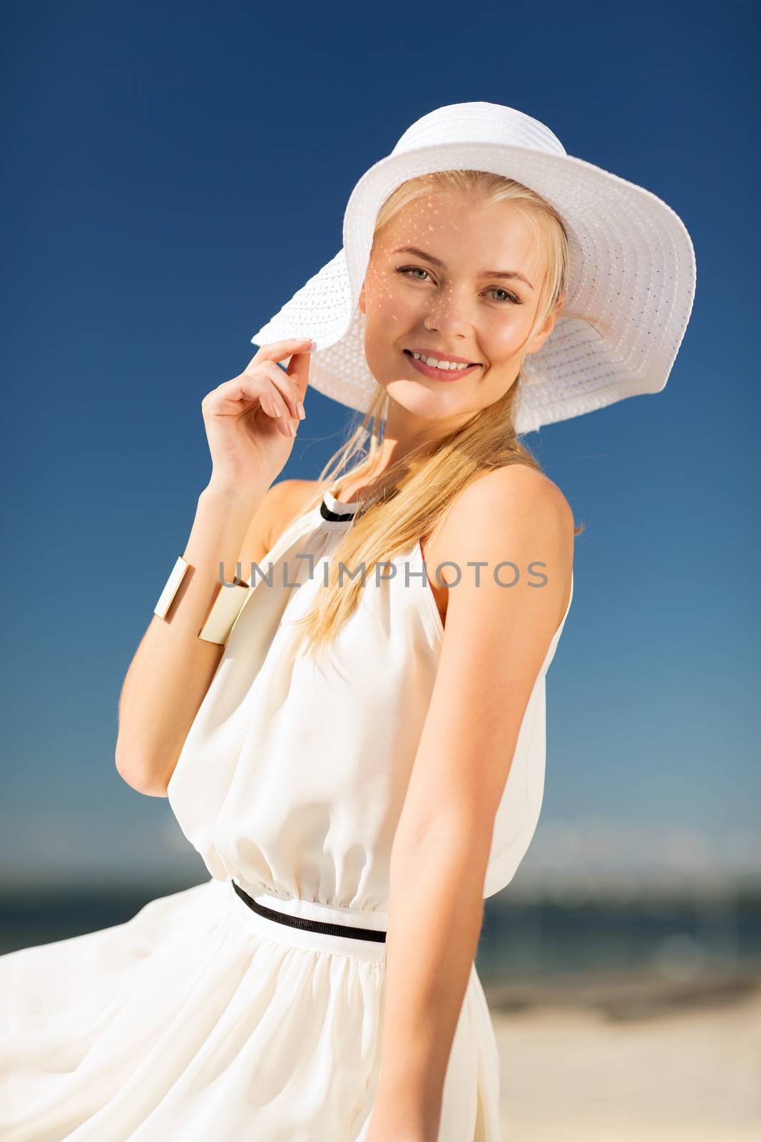 beautiful woman enjoying summer outdoors by dolgachov