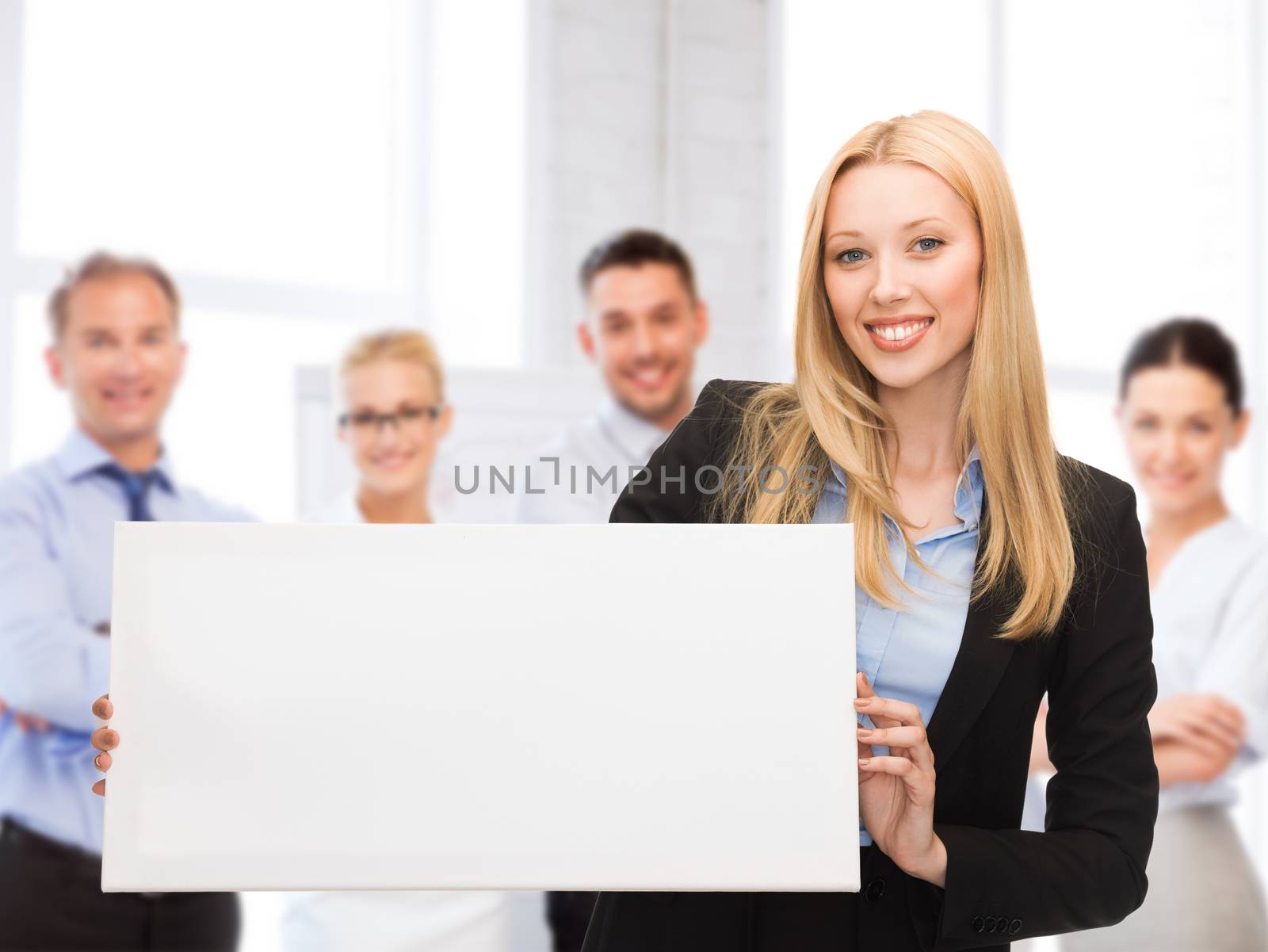 businesswoman with white blank board by dolgachov