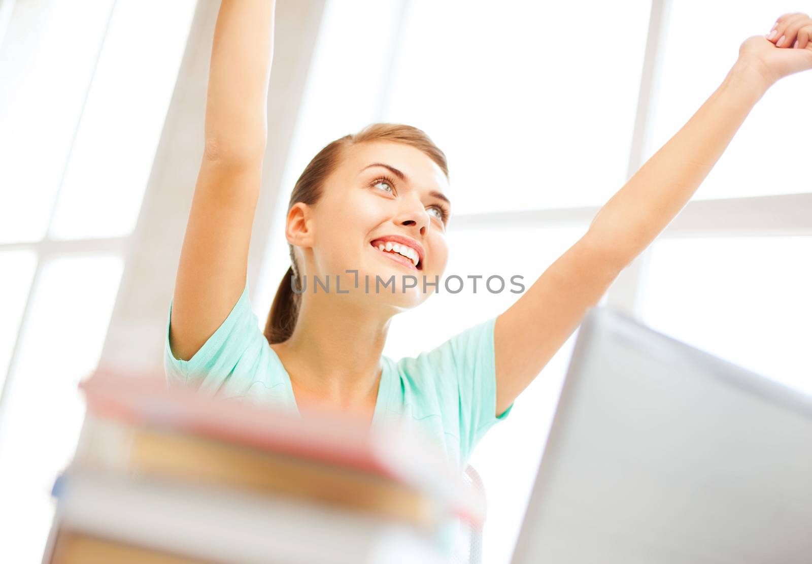 education concept - happy student girl with computer at school