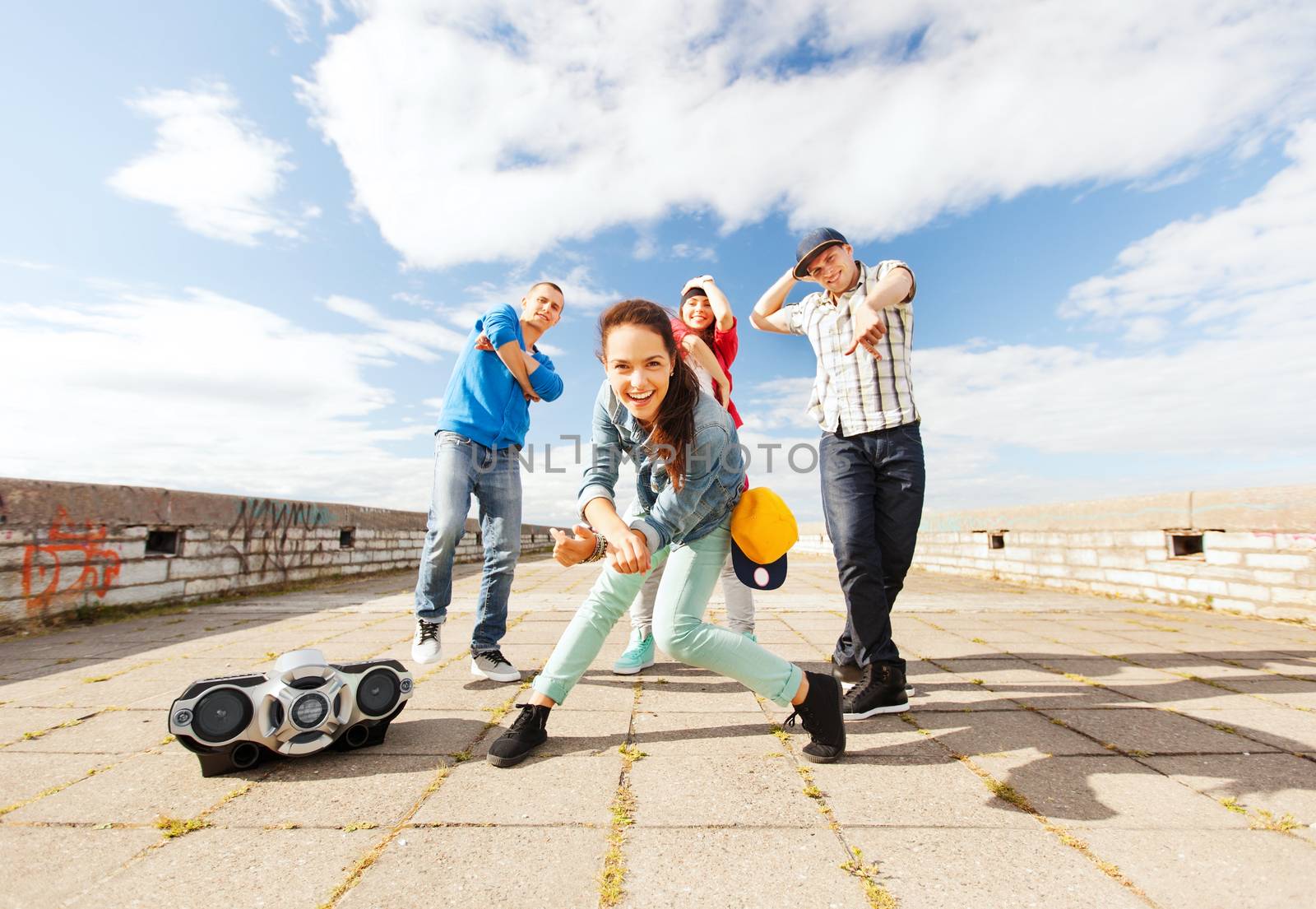 sport, dancing and urban culture concept - group of teenagers dancing