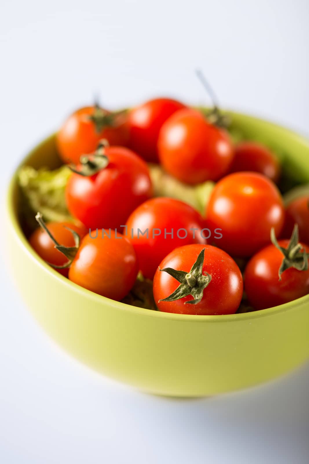 food and cooking concept - cherry tomatoes in bowl
