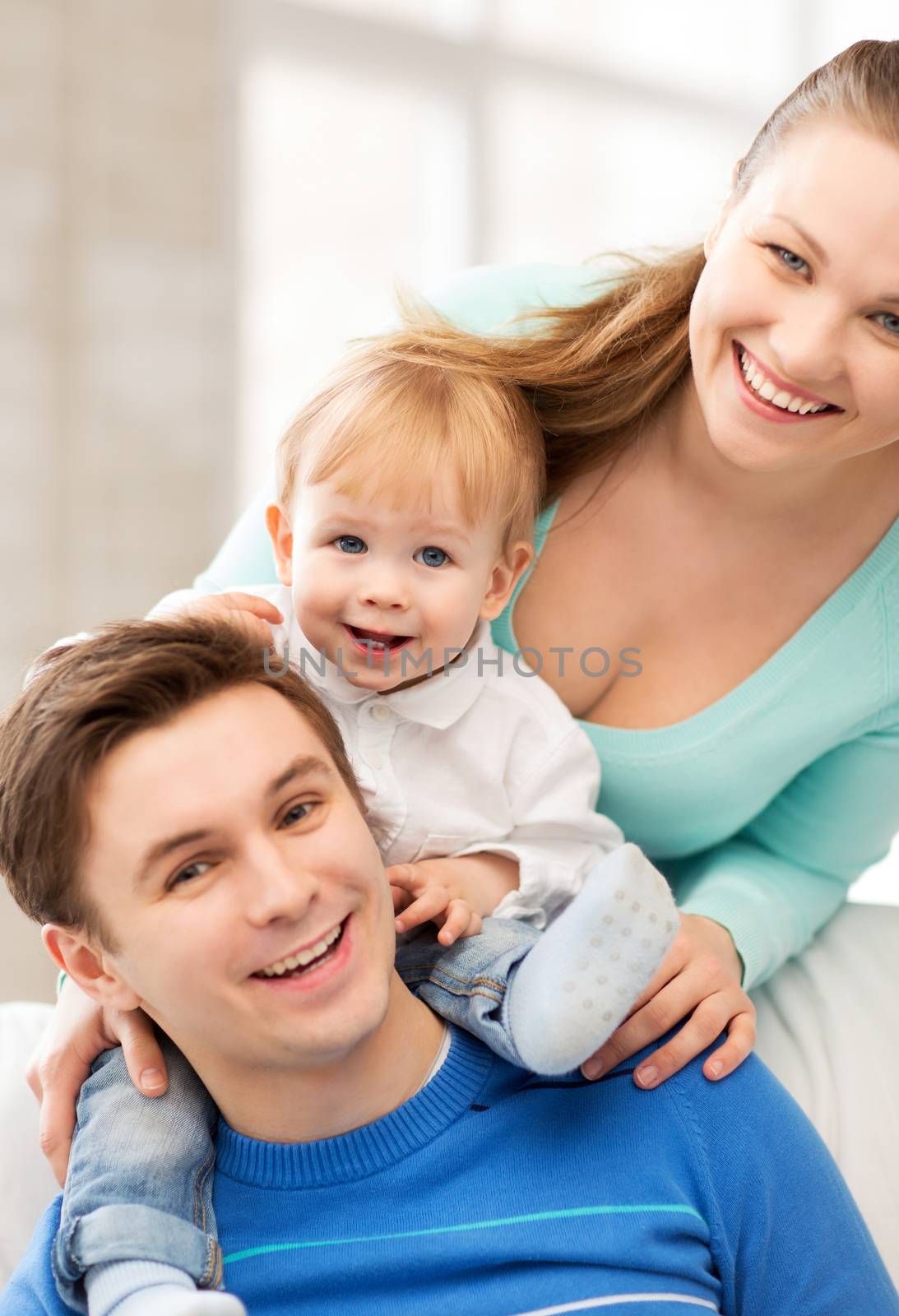 picture of happy parents playing with adorable baby