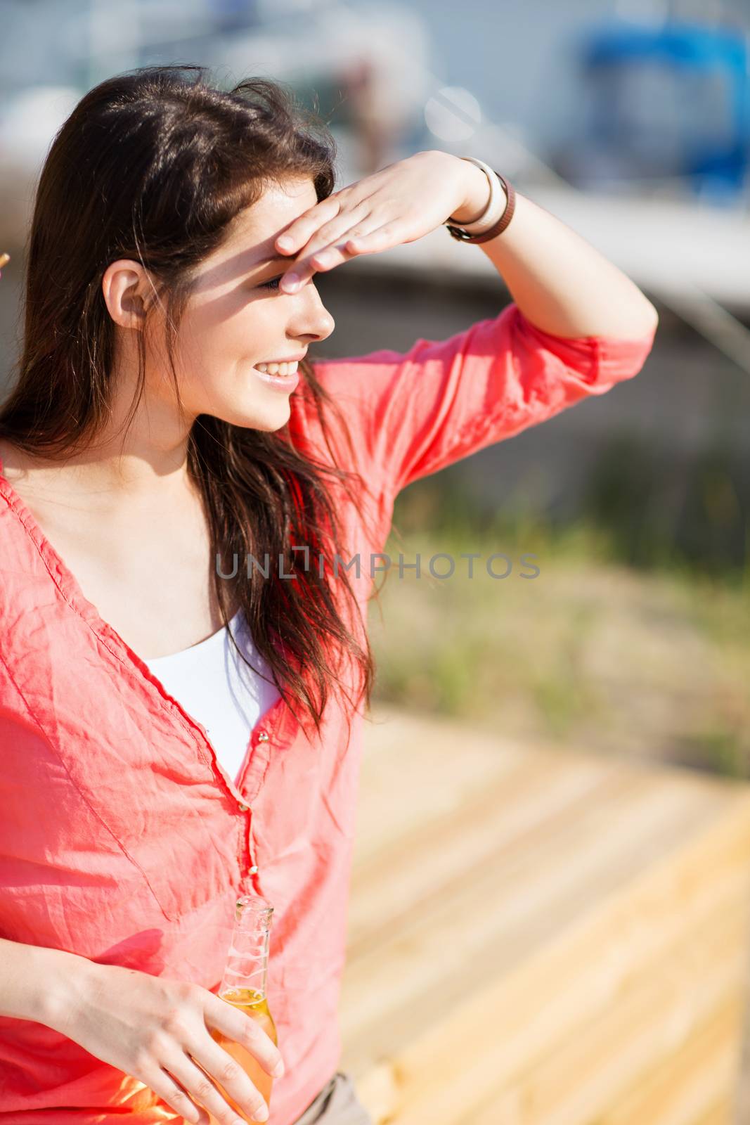 summer holidays and vacation - girl with drink on the beach