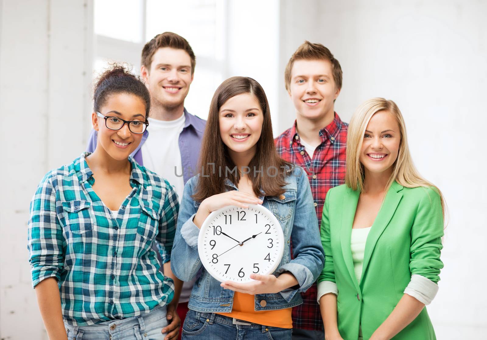 group of students at school with clock by dolgachov