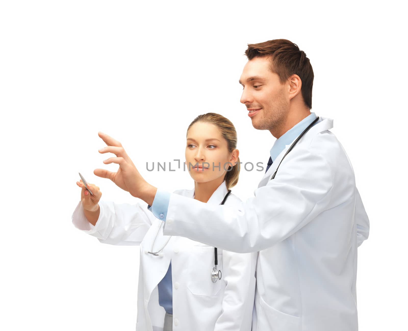 healthcare, medical and technology concept - two young doctors working with something imaginary