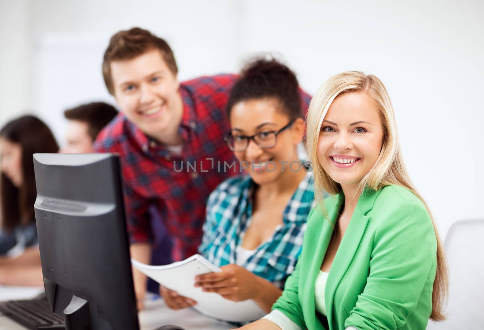 education, technology and internet - students with computer studying at school