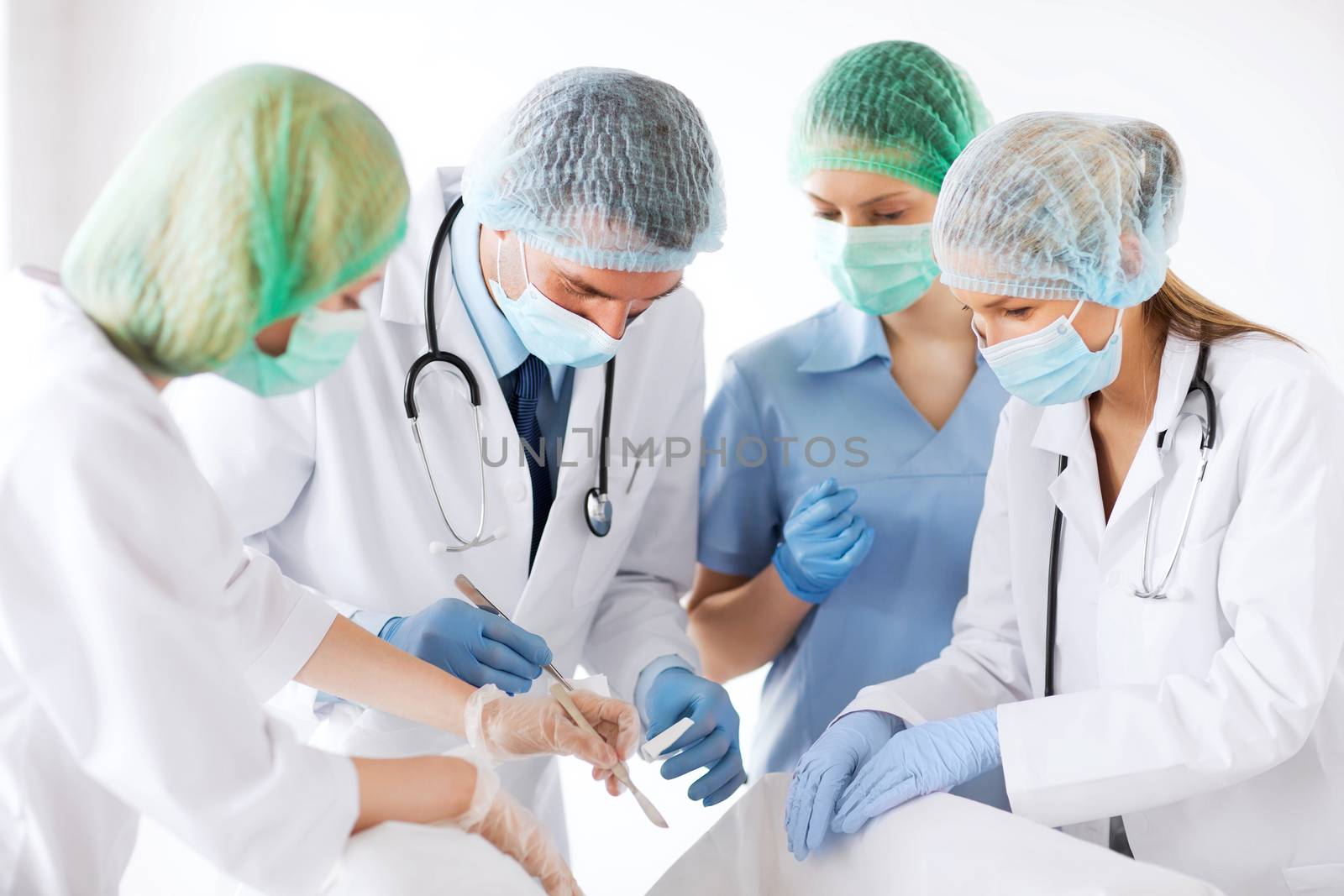 young group of doctors doing operation by dolgachov