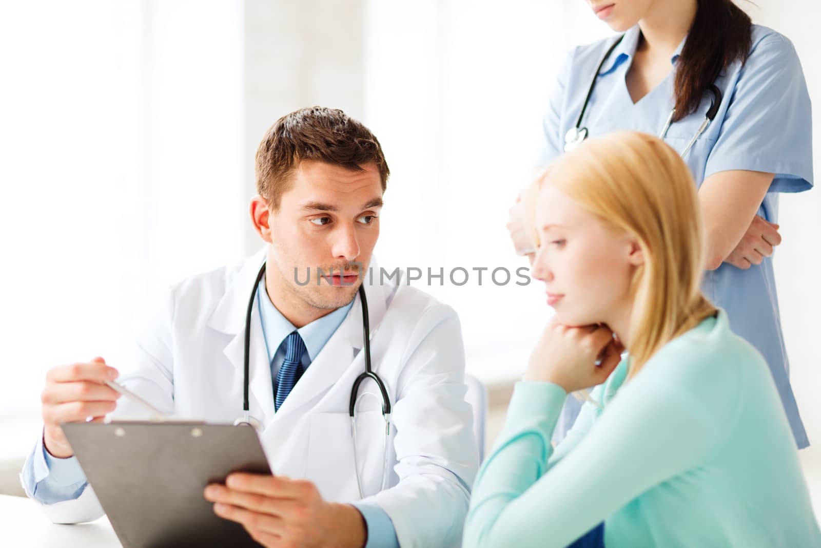 healthcare and medical concept - doctor and nurse with patient in hospital