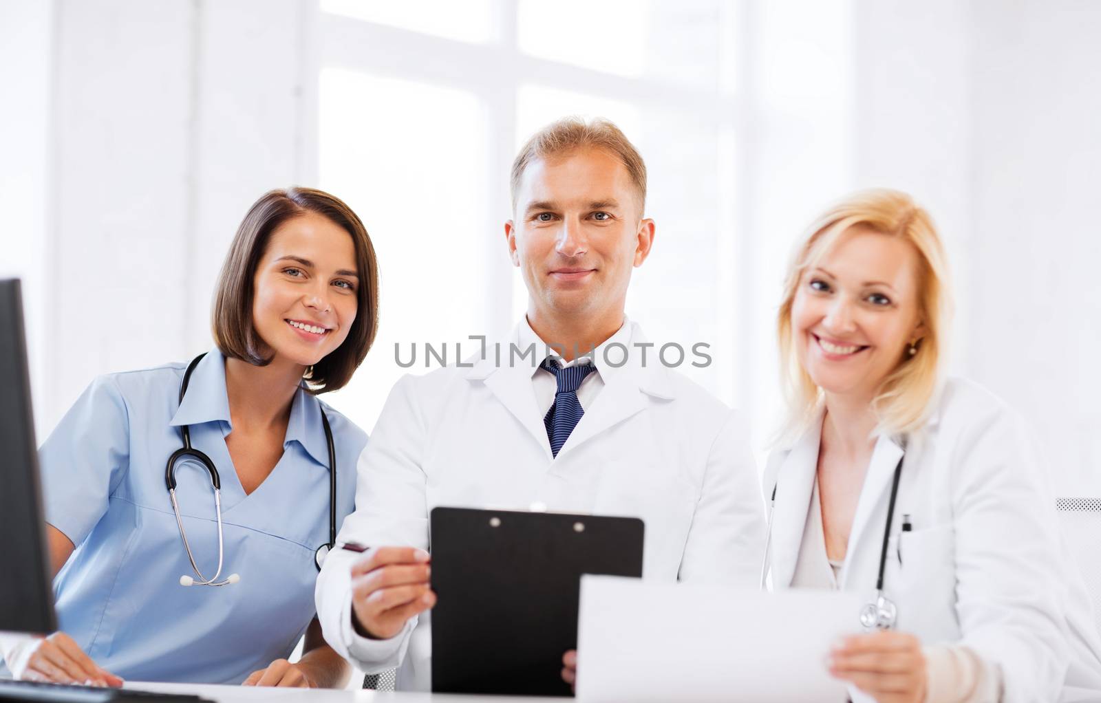 team or group of doctors on meeting by dolgachov