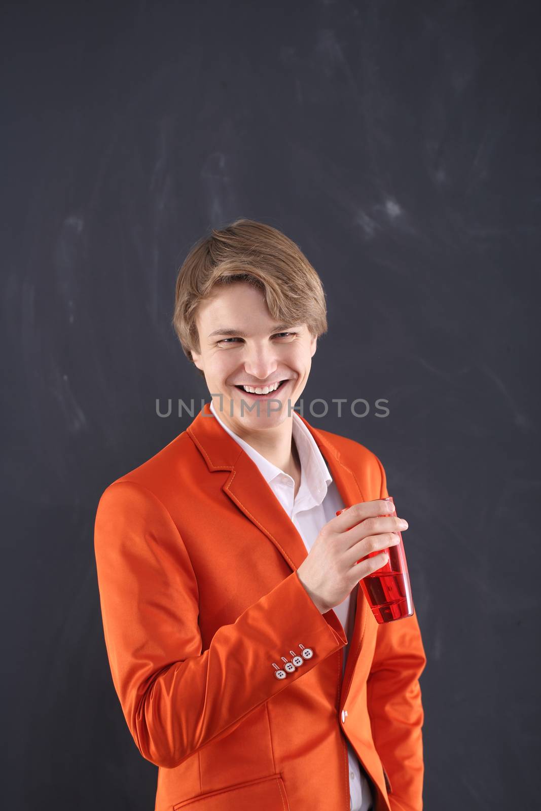Smiling young worker with red mug