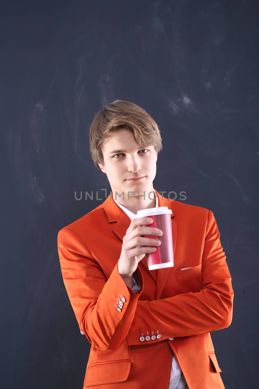 Profile of a young man drinking from a glass