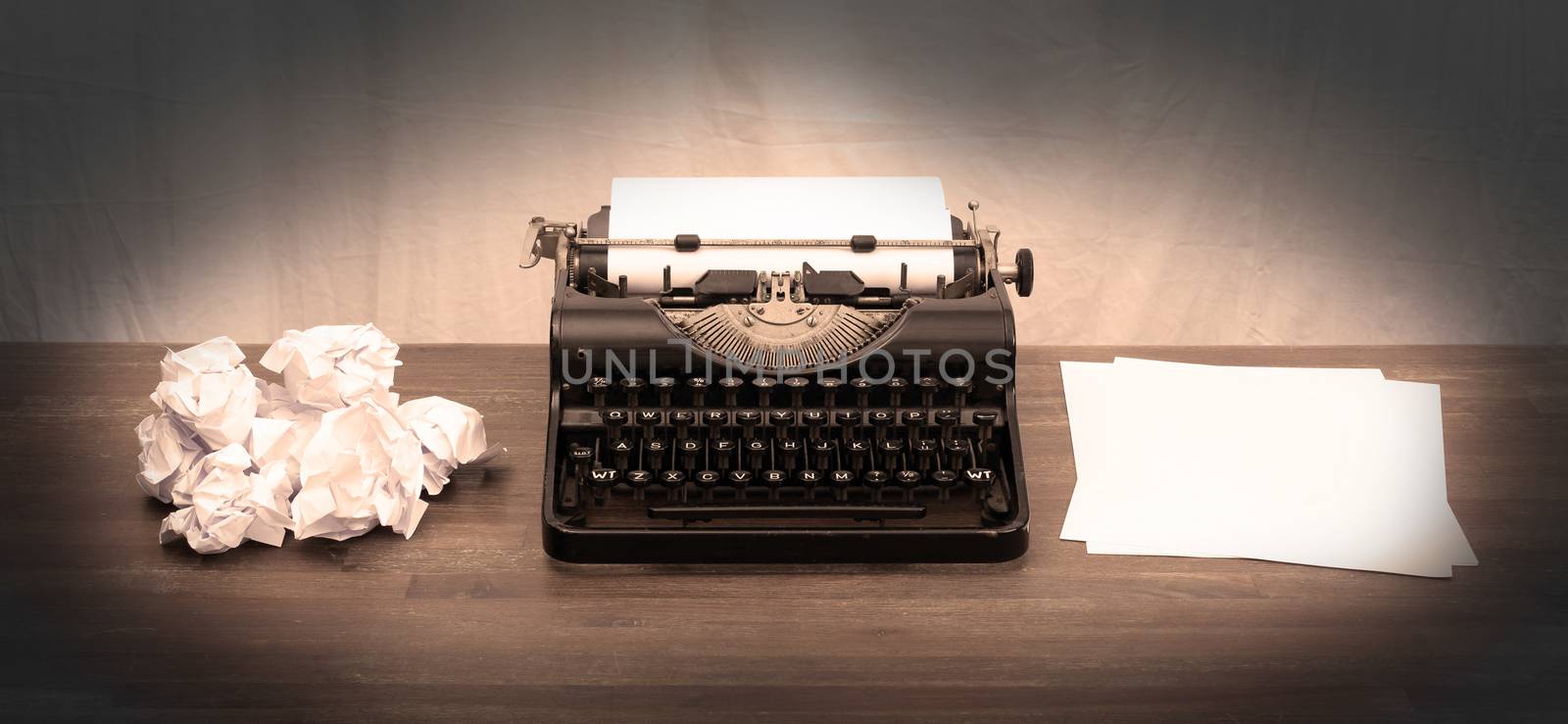 Vintage typewriter on wooden table, touch-up in retro style