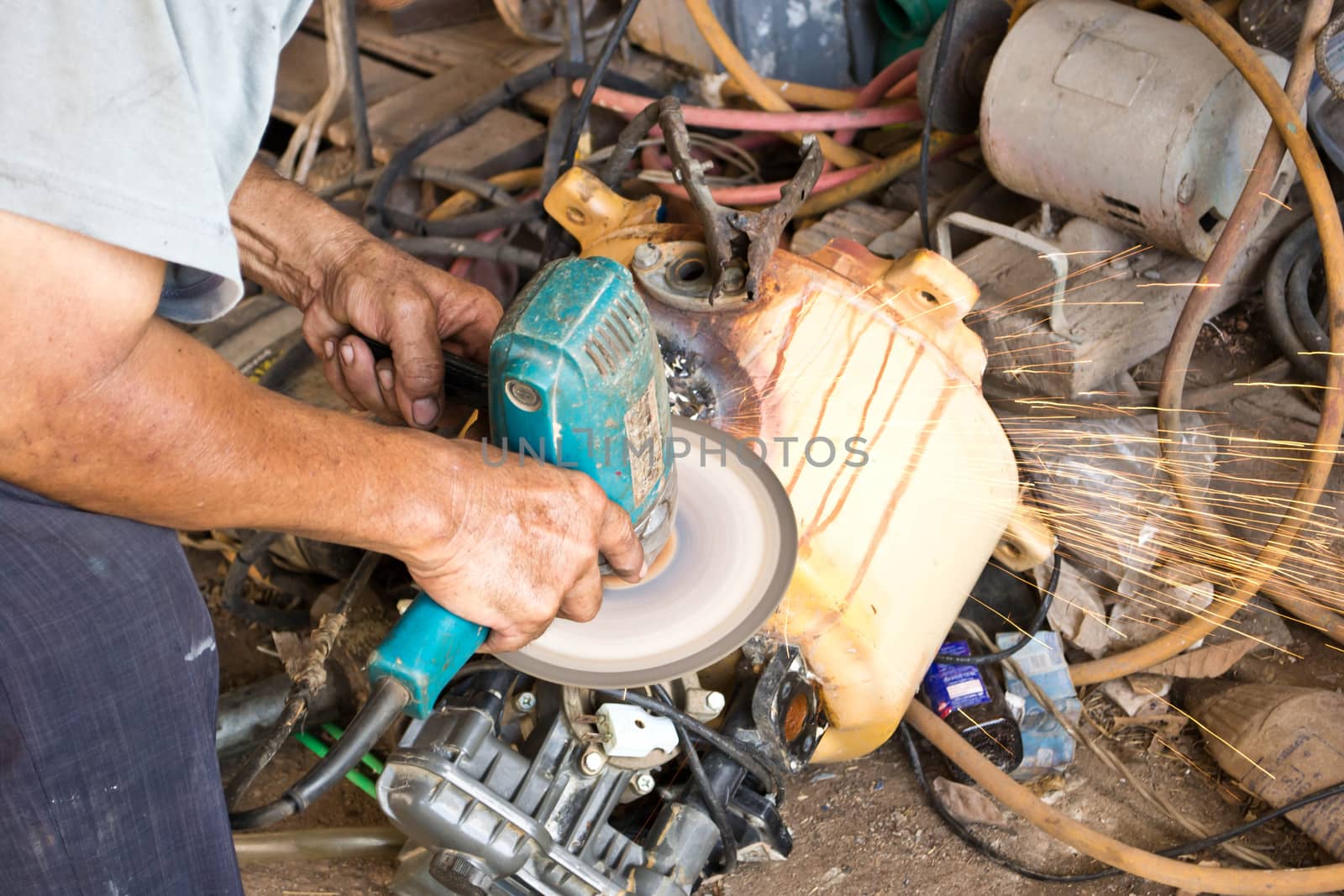 Electric wheel grinding on steel structure by Thanamat