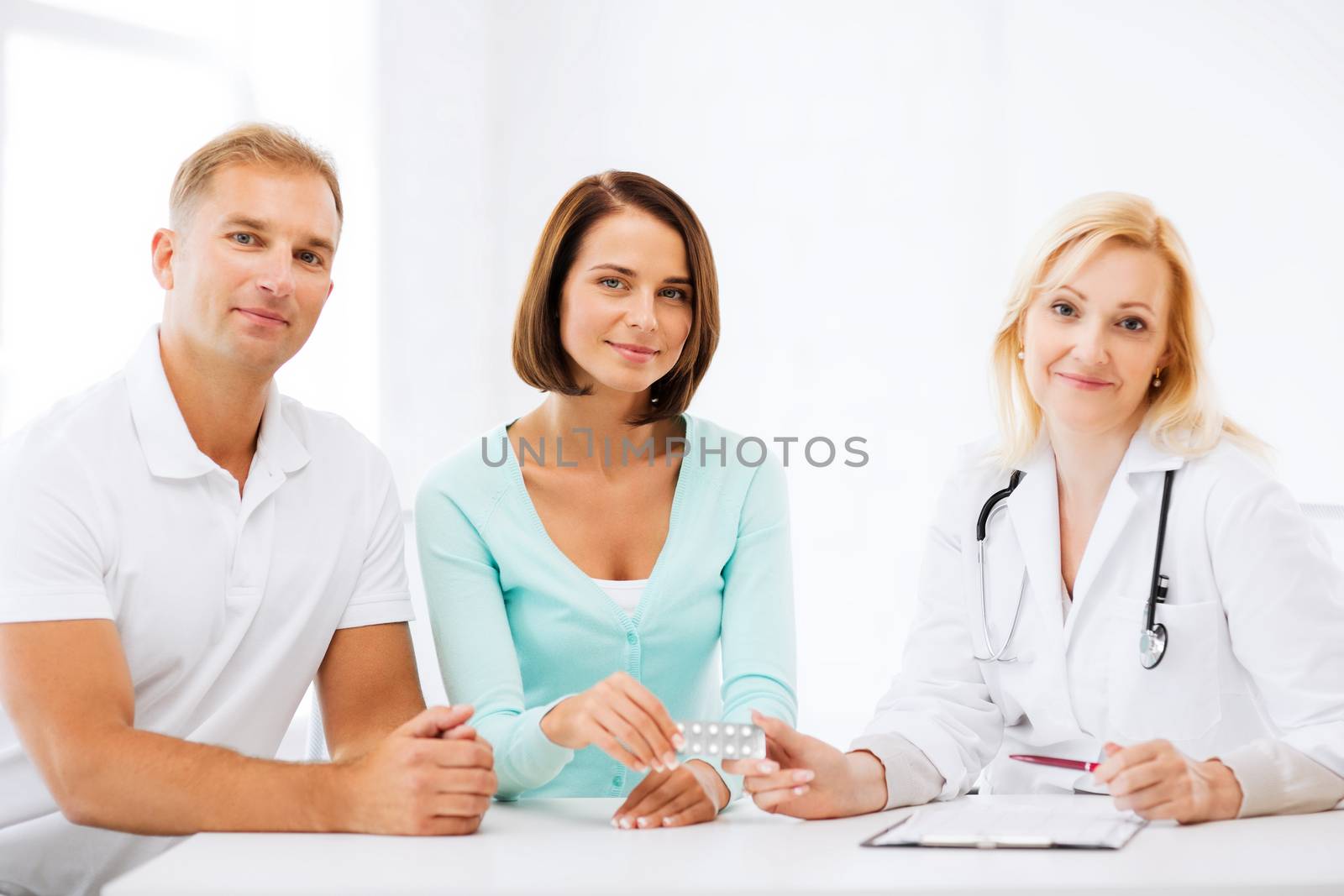 healthcare and medical - doctor giving pills to patients