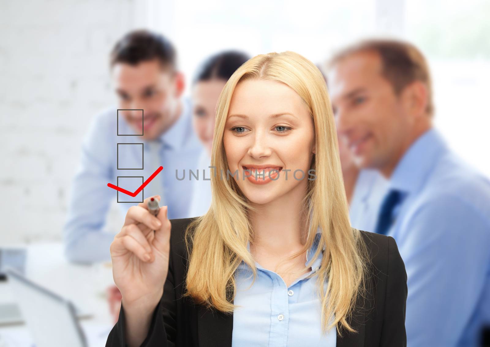 business and technology concept - businesswoman drawing checkmark on virtual screen