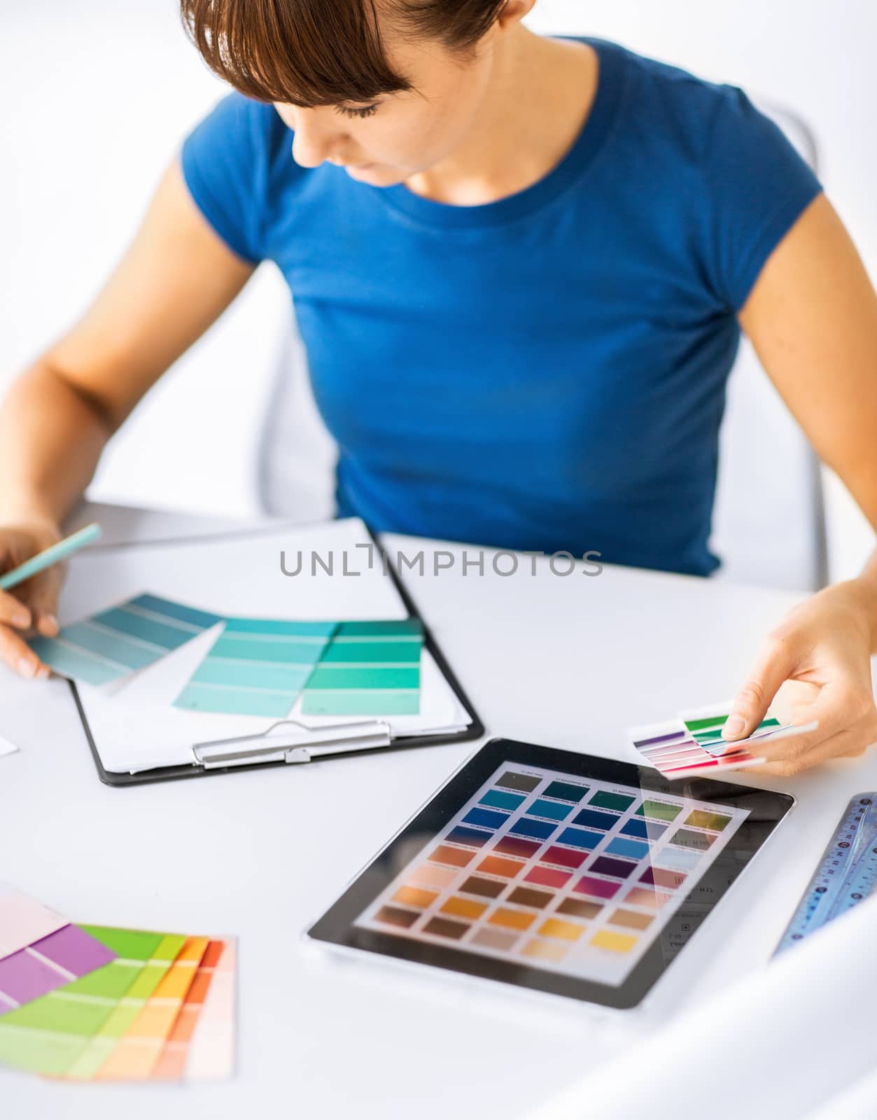 woman working with color samples for selection by dolgachov