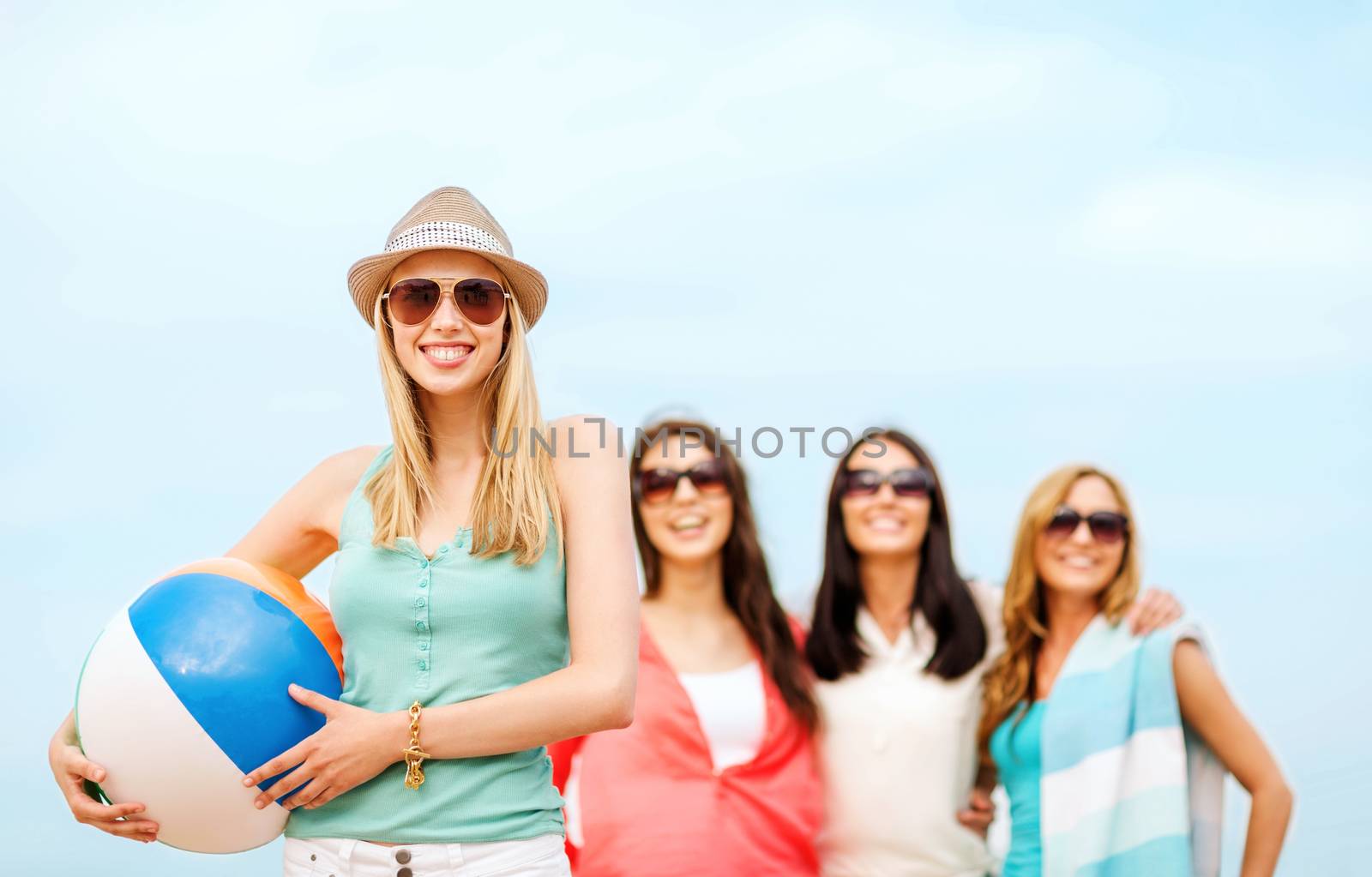 girl with ball and friends on the beach by dolgachov
