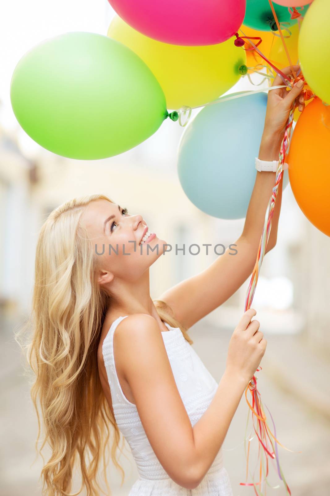 woman with colorful balloons by dolgachov
