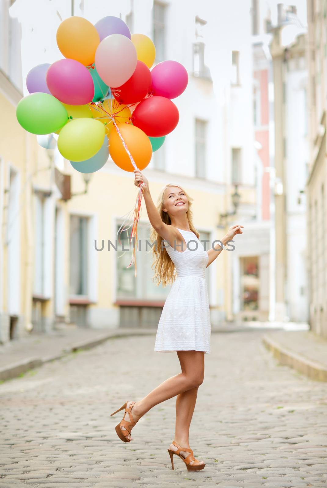 woman with colorful balloons by dolgachov