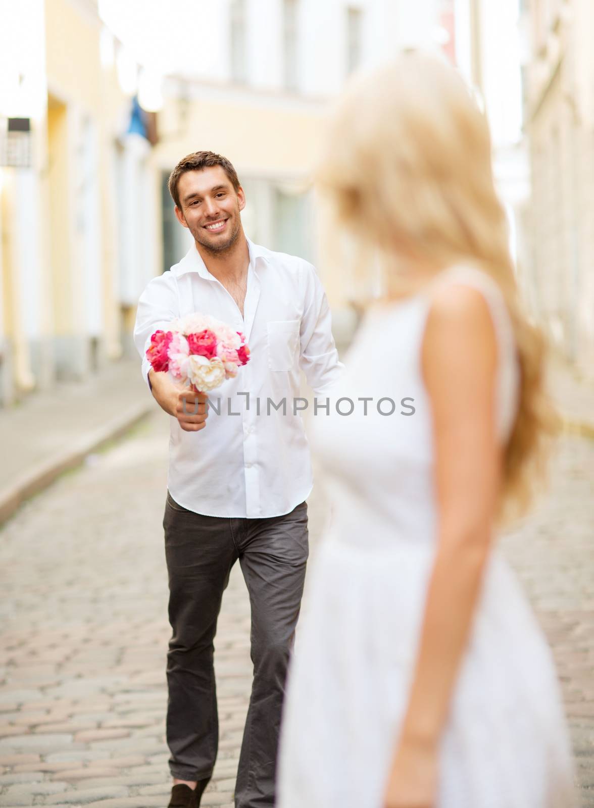 couple with flowers in the city by dolgachov