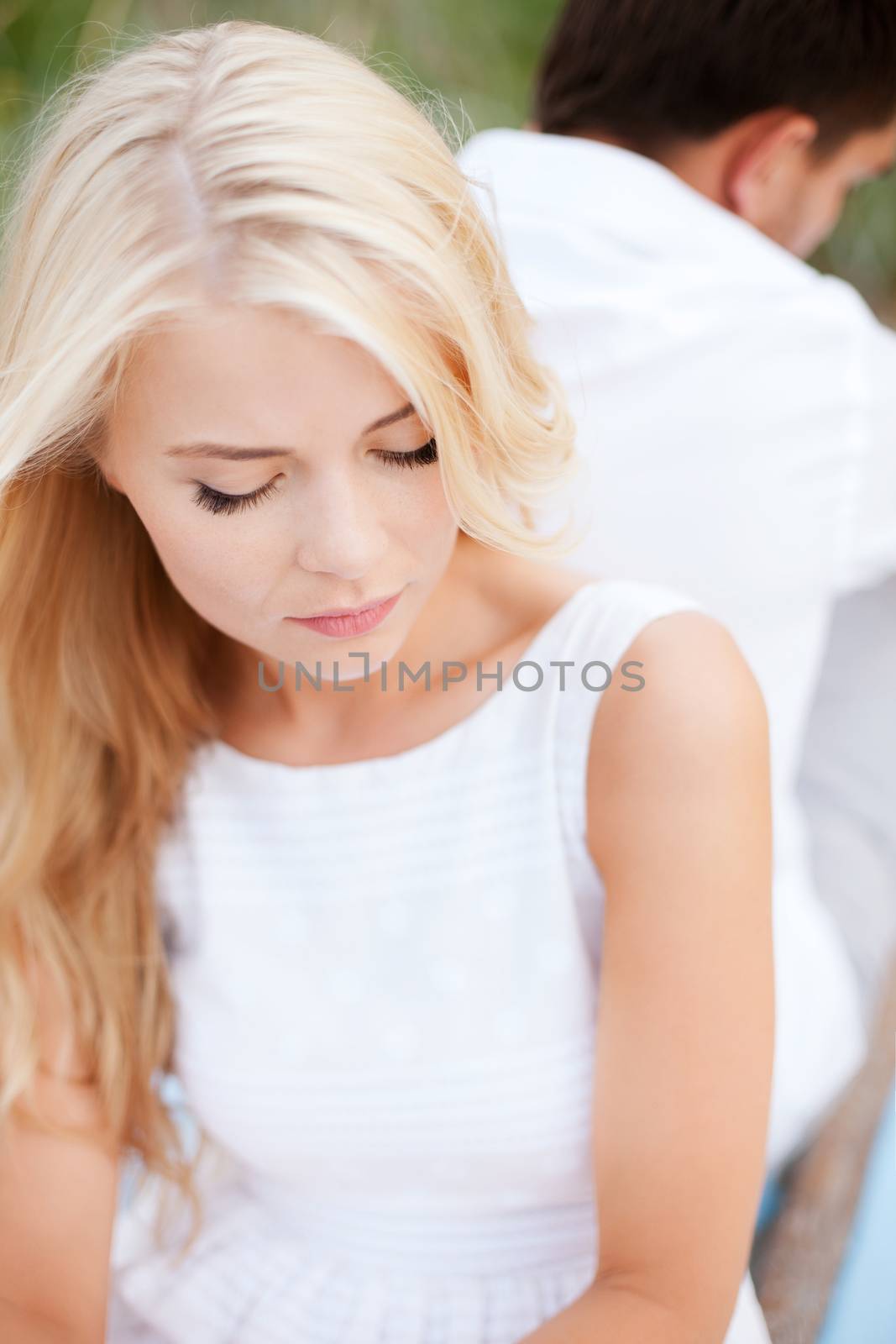 dating and relationships concept - stressed woman with man outside
