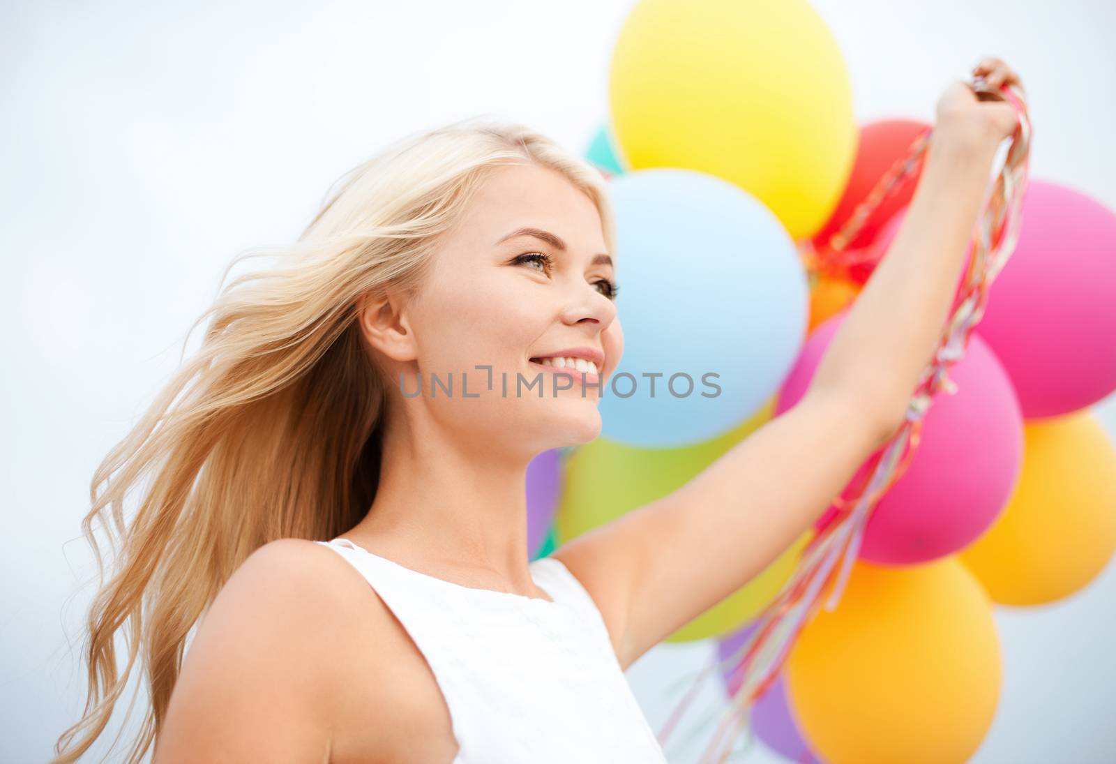 summer holidays, celebration and lifestyle concept - beautiful woman with colorful balloons outside