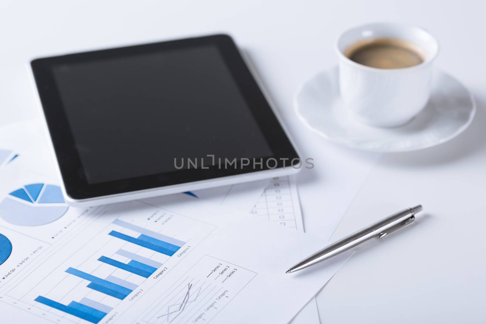 business and technology concept - tablet pc with cup of coffee