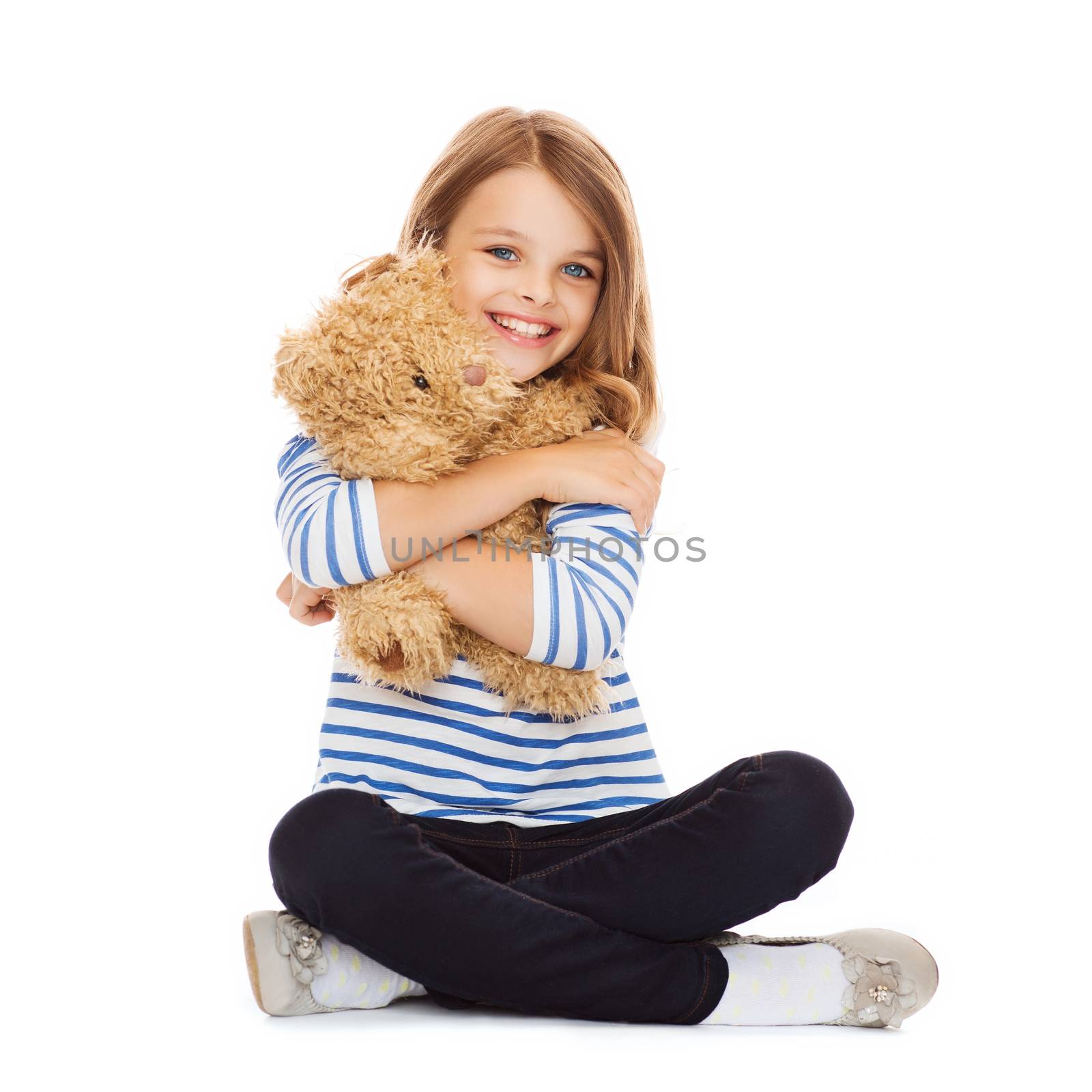 childhood, toys and shopping concept - cute little girl hugging teddy bear