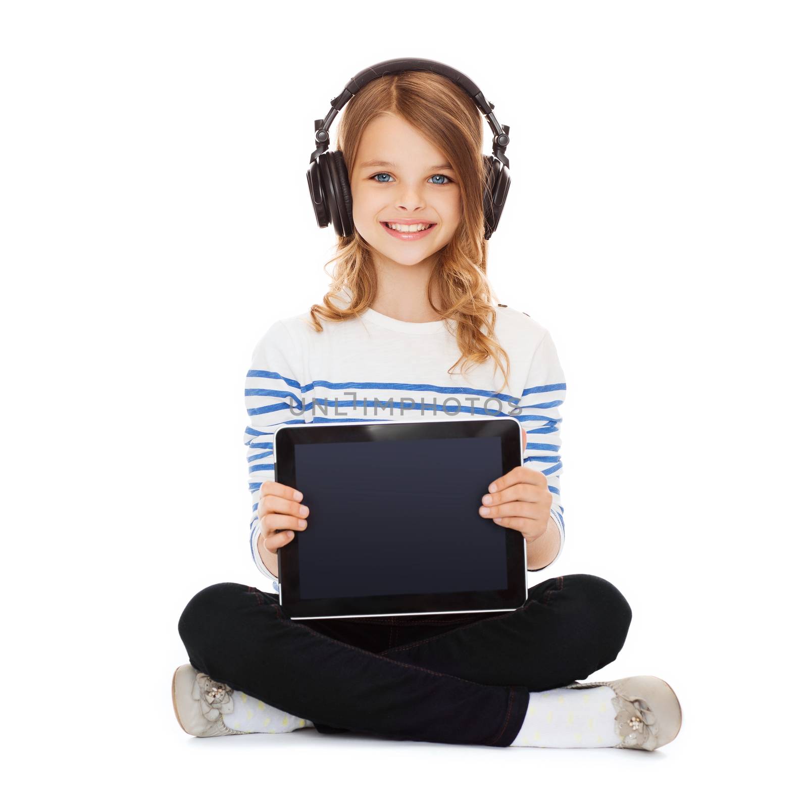 music, technology and shopping concept - child with headphones showing tablet pc