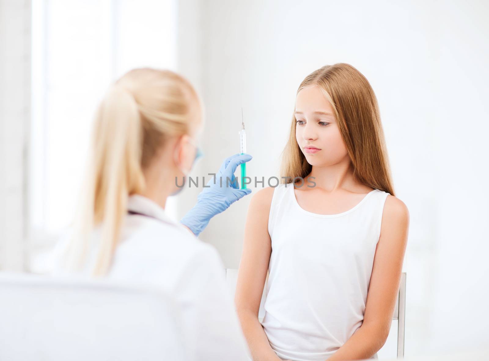 healthcare and medical concept - doctor doing vaccine to child in hospital