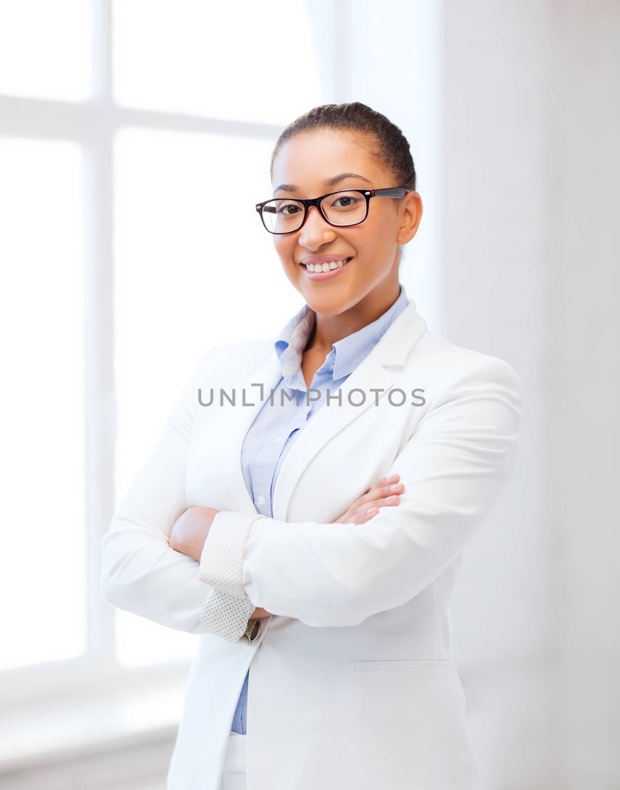 african businesswoman in office by dolgachov