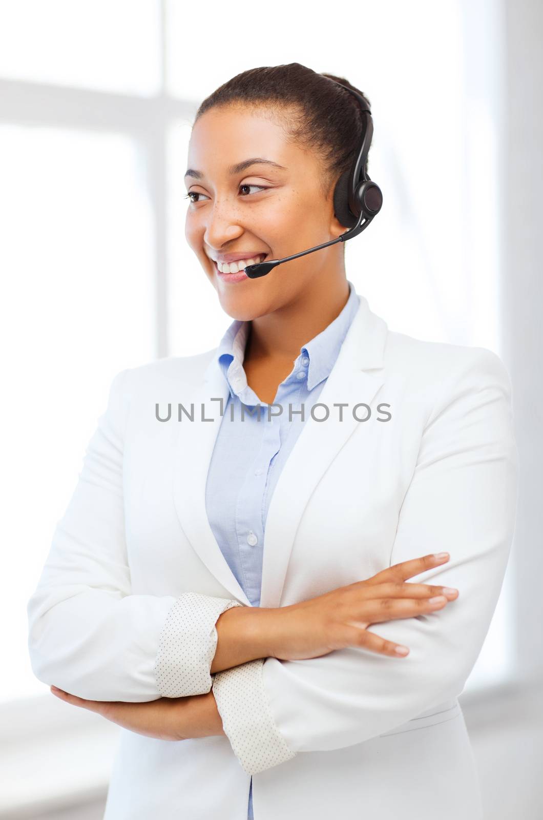 business, communication and call center - african helpline operator with headphones