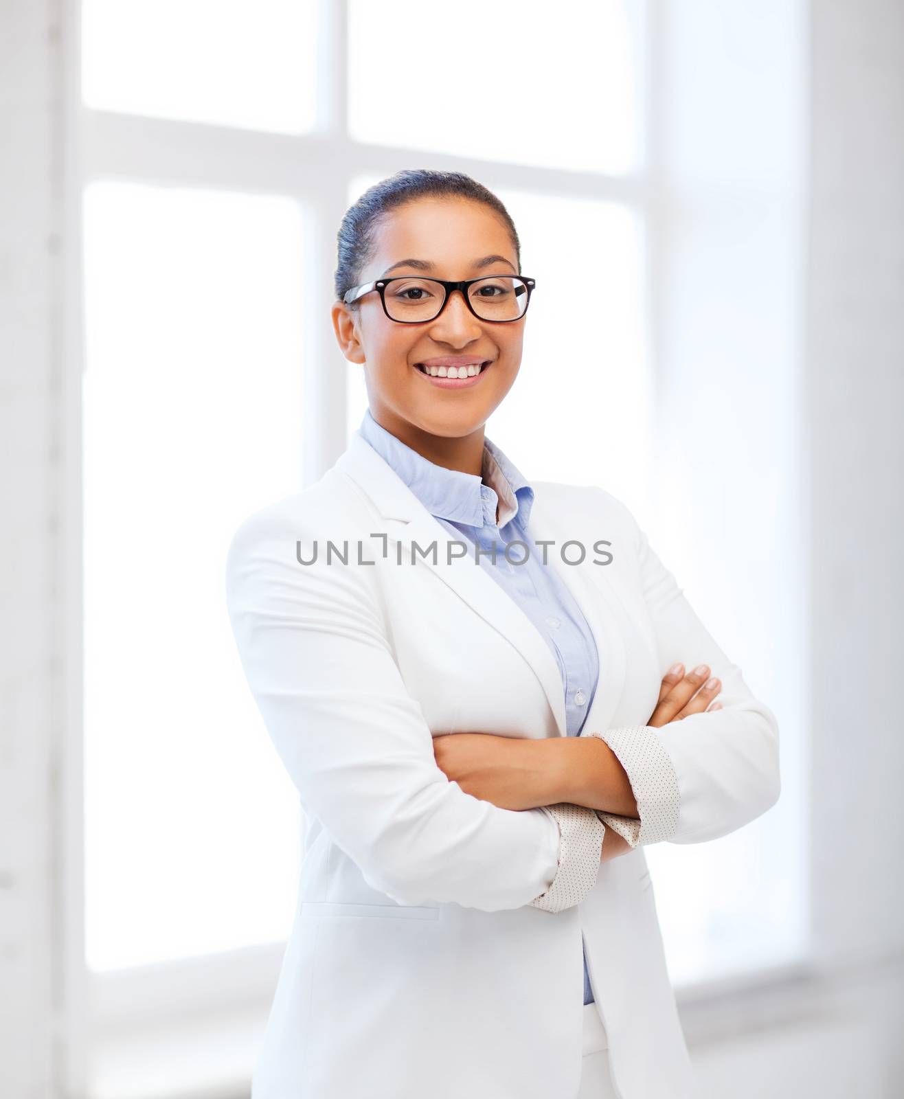 business and education concept - african businesswoman in office