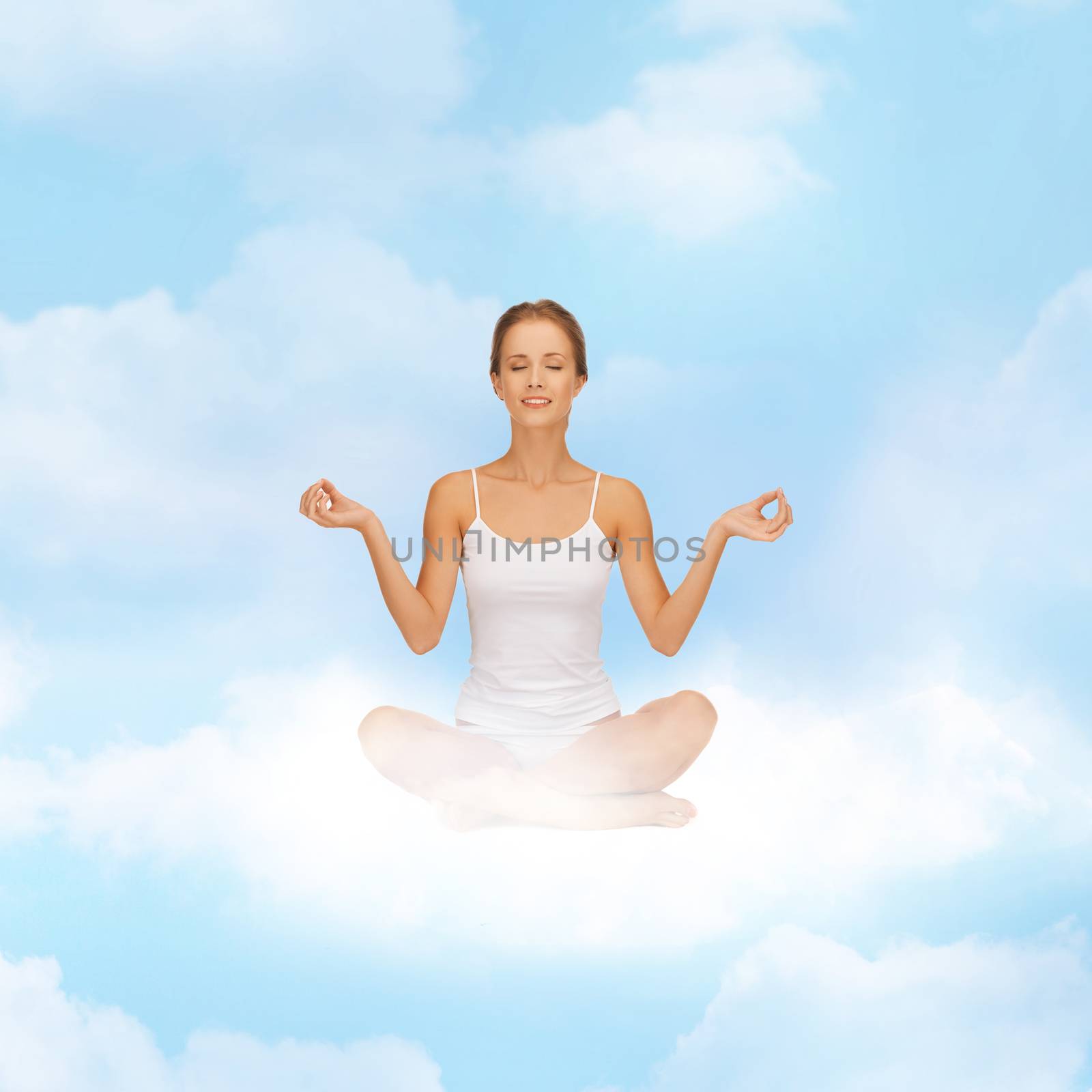 relaxation, meditation and lifestyle concept - girl on the cloud in lotus position and meditating