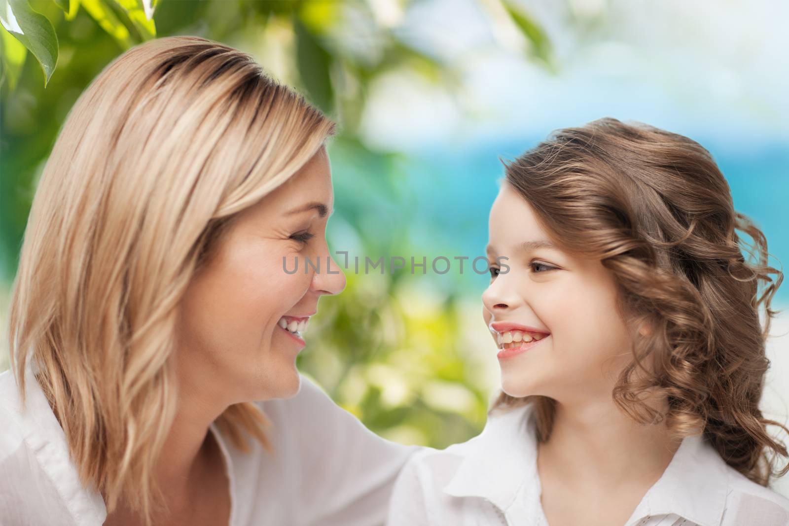 parenting and motherhood concept - happy mother and daughter