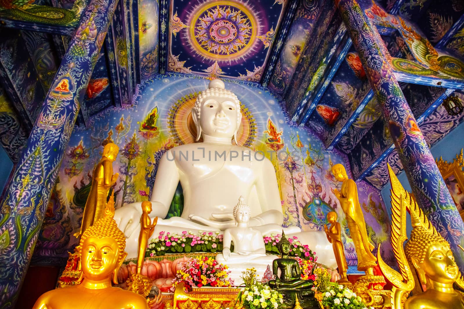 white Buddha image in temple hall,Chiangrai,Thailand