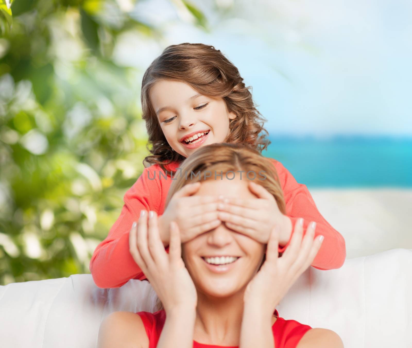 family and holidays concept - happy mother and daughter