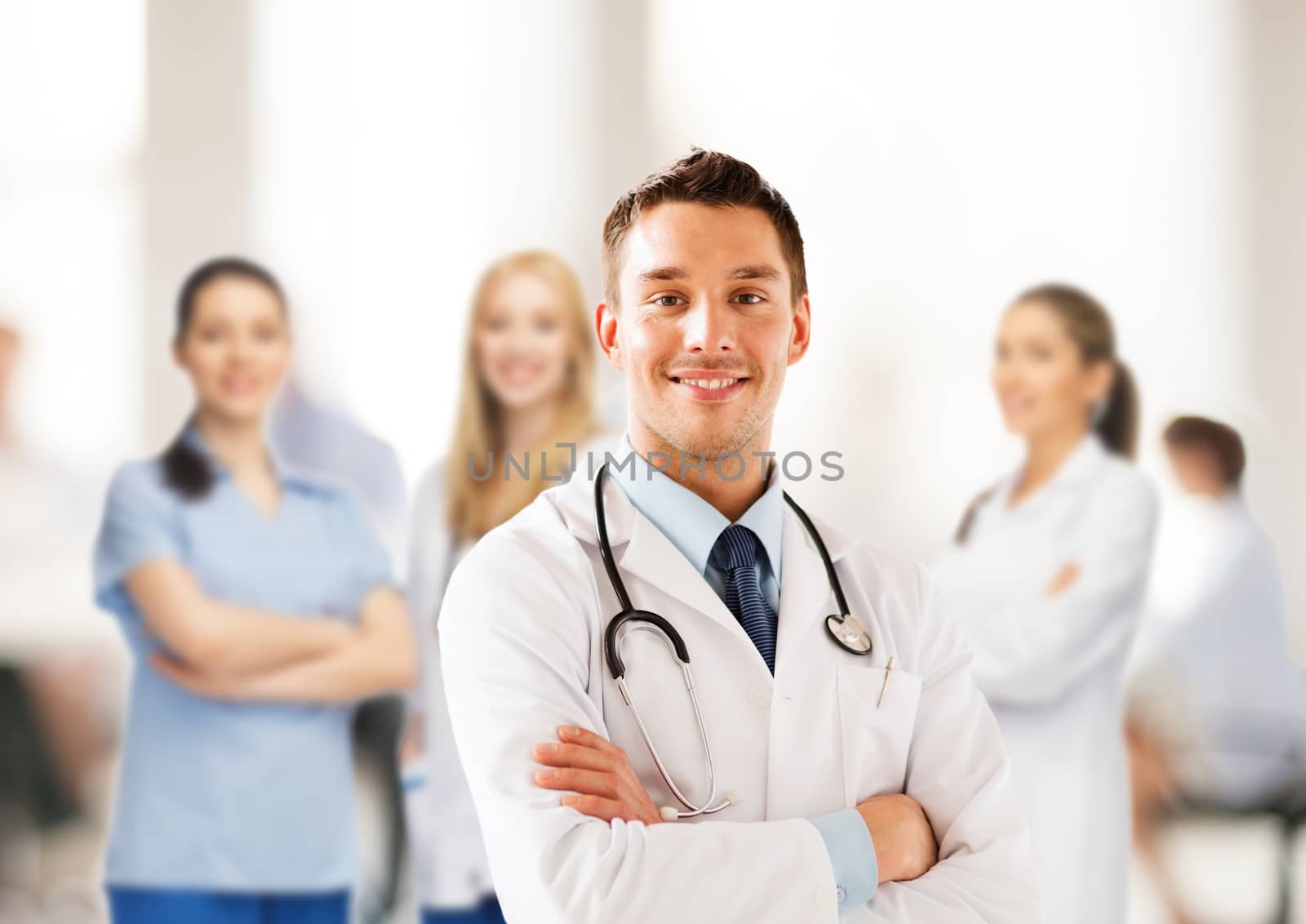 young male doctor with stethoscope by dolgachov