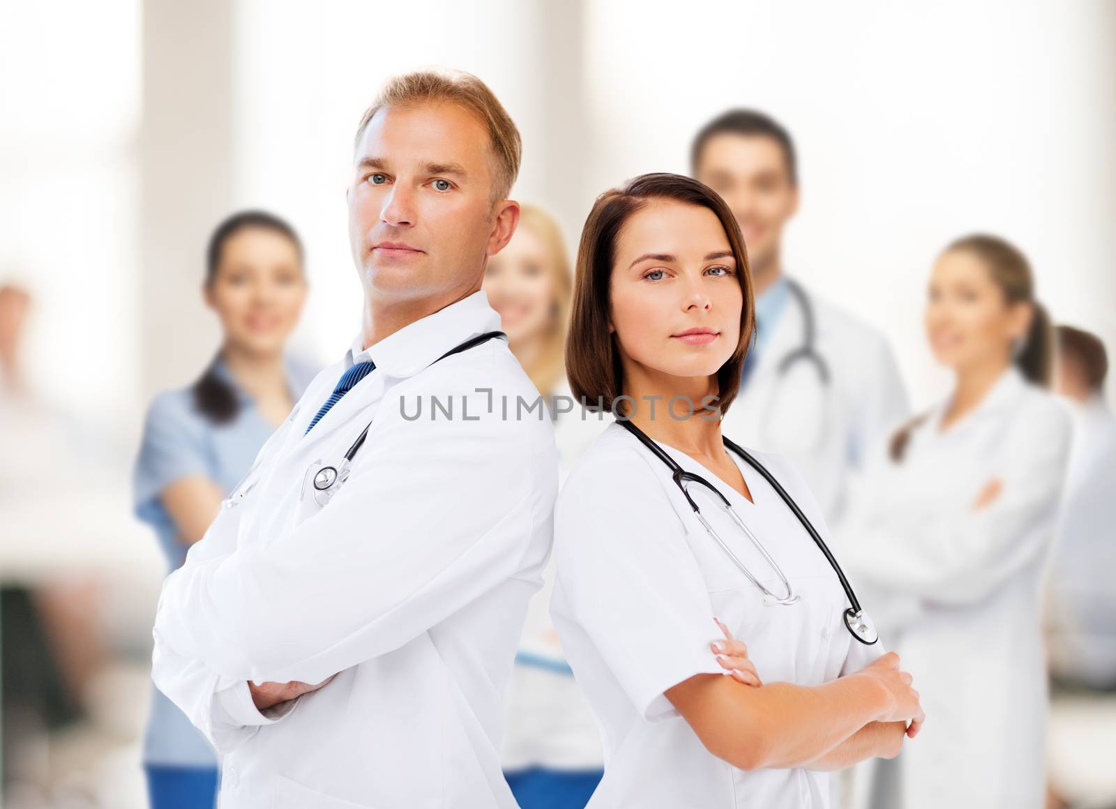 healthcare and medical concept - two doctors with stethoscopes