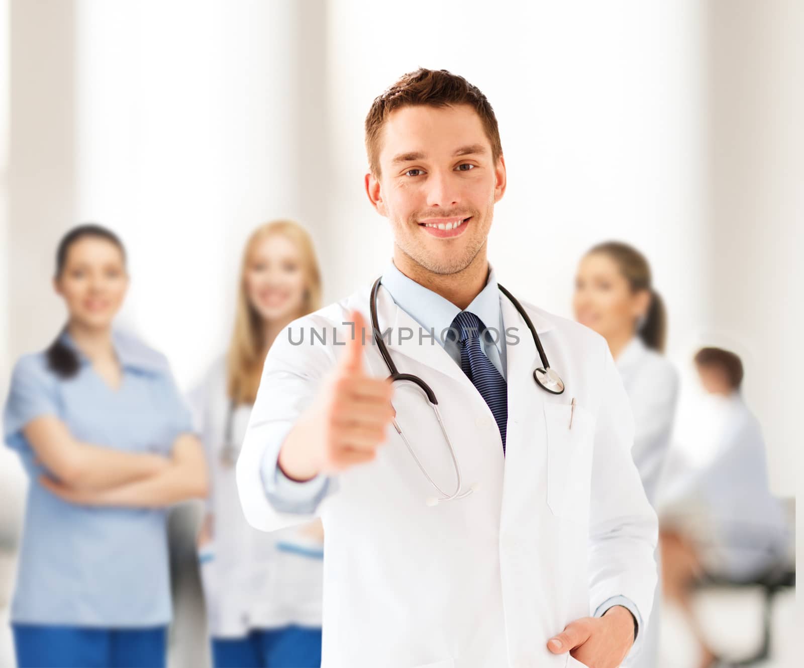 doctor with stethoscope showing thumbs up by dolgachov