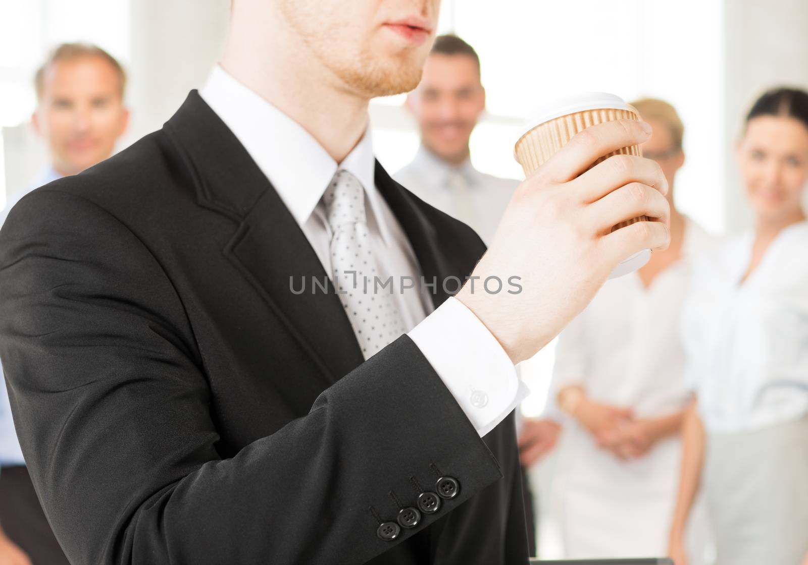 business concept - man holding take away coffee cup