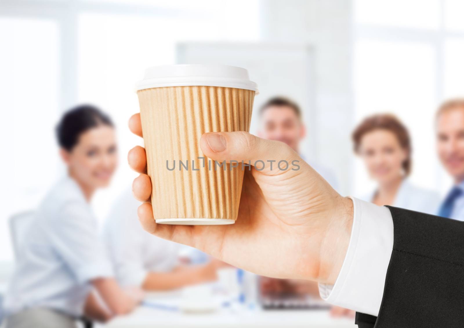 business concept - man holding take away coffee cup