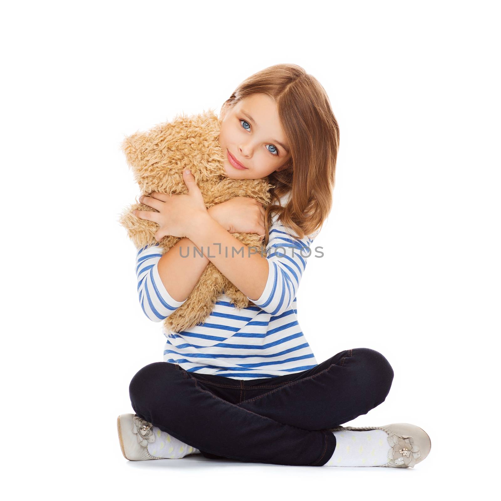 childhood, toys and shopping concept - cute little girl hugging teddy bear