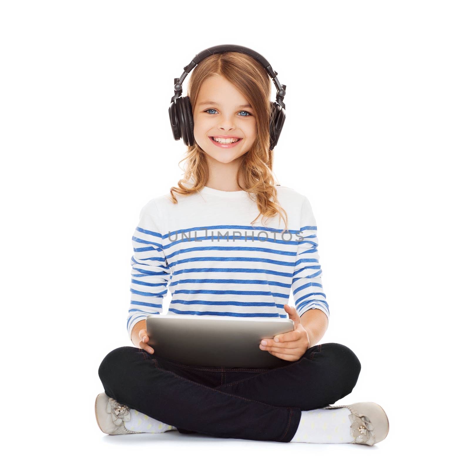 child with headphones and tablet pc by dolgachov