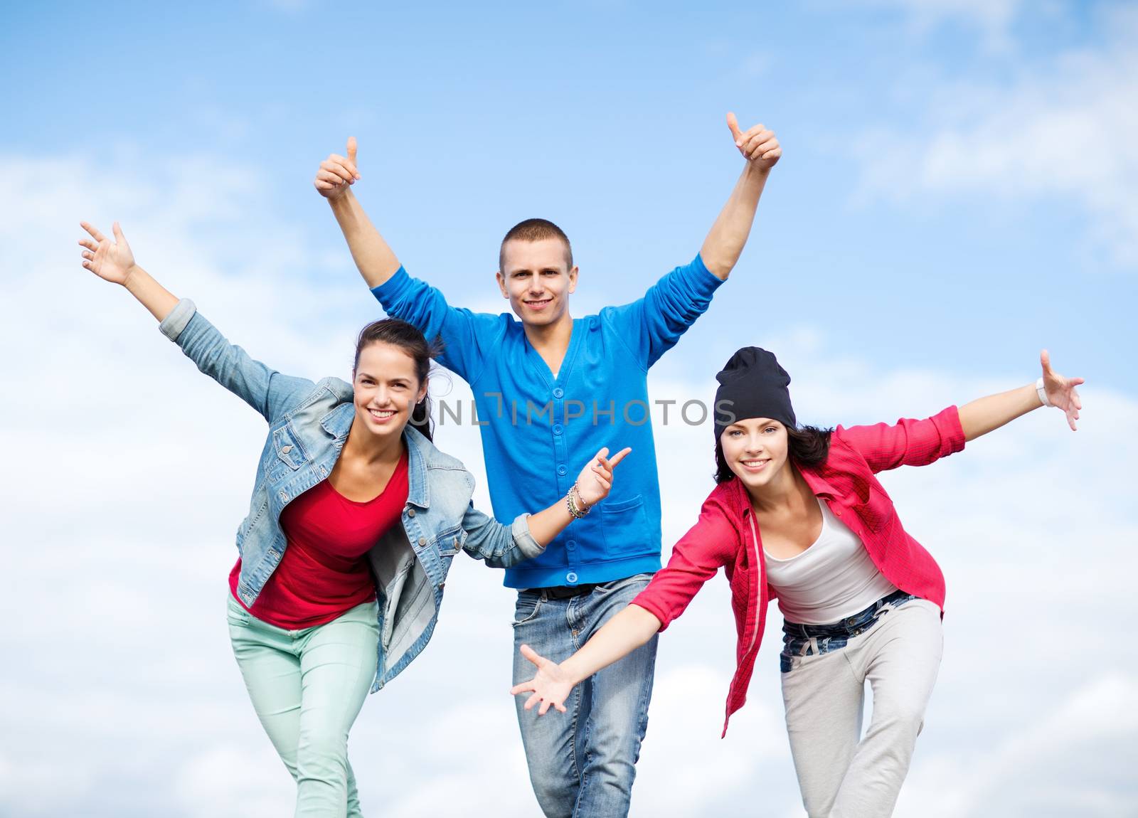 group of teenagers dancing by dolgachov