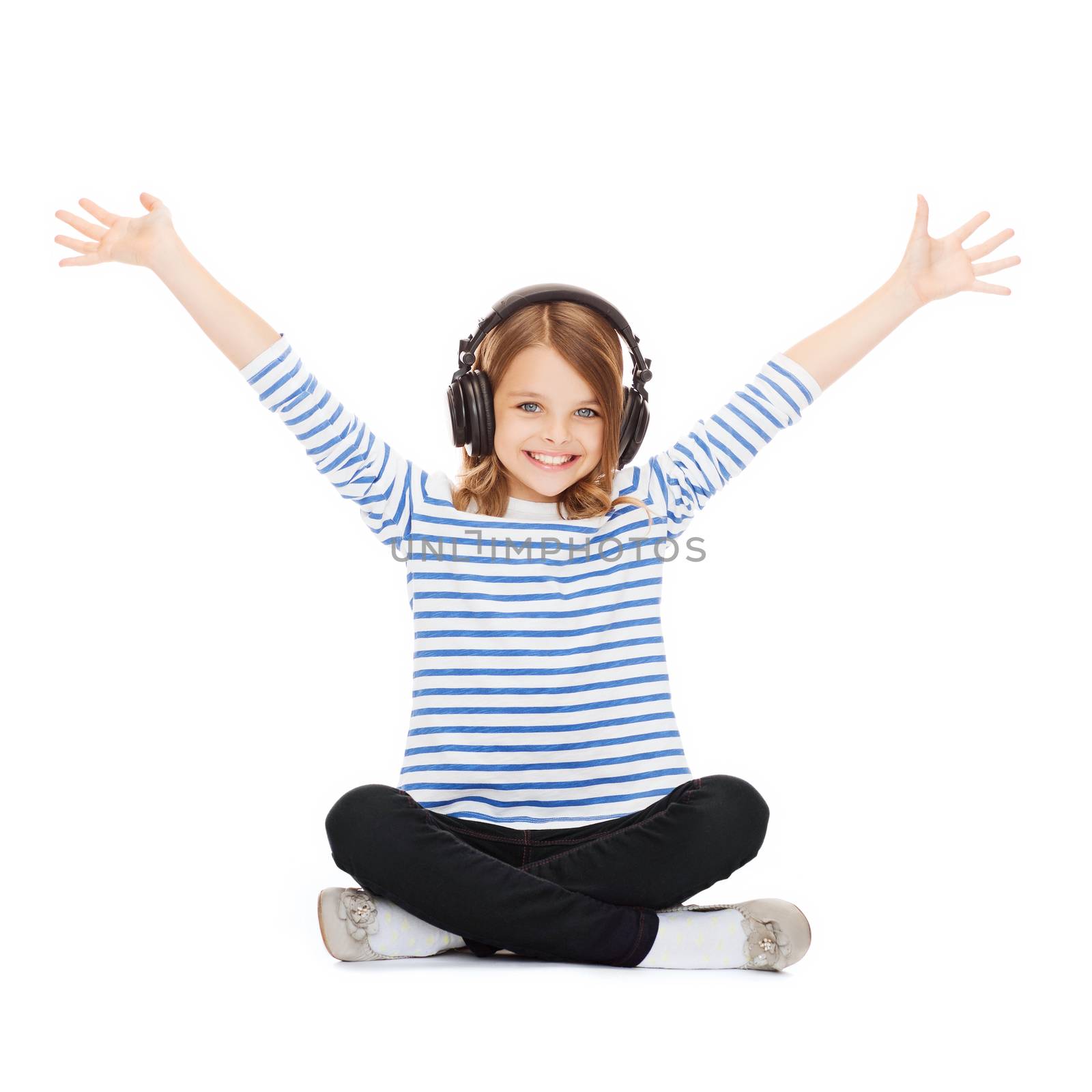 music and technology concept - child with headphones