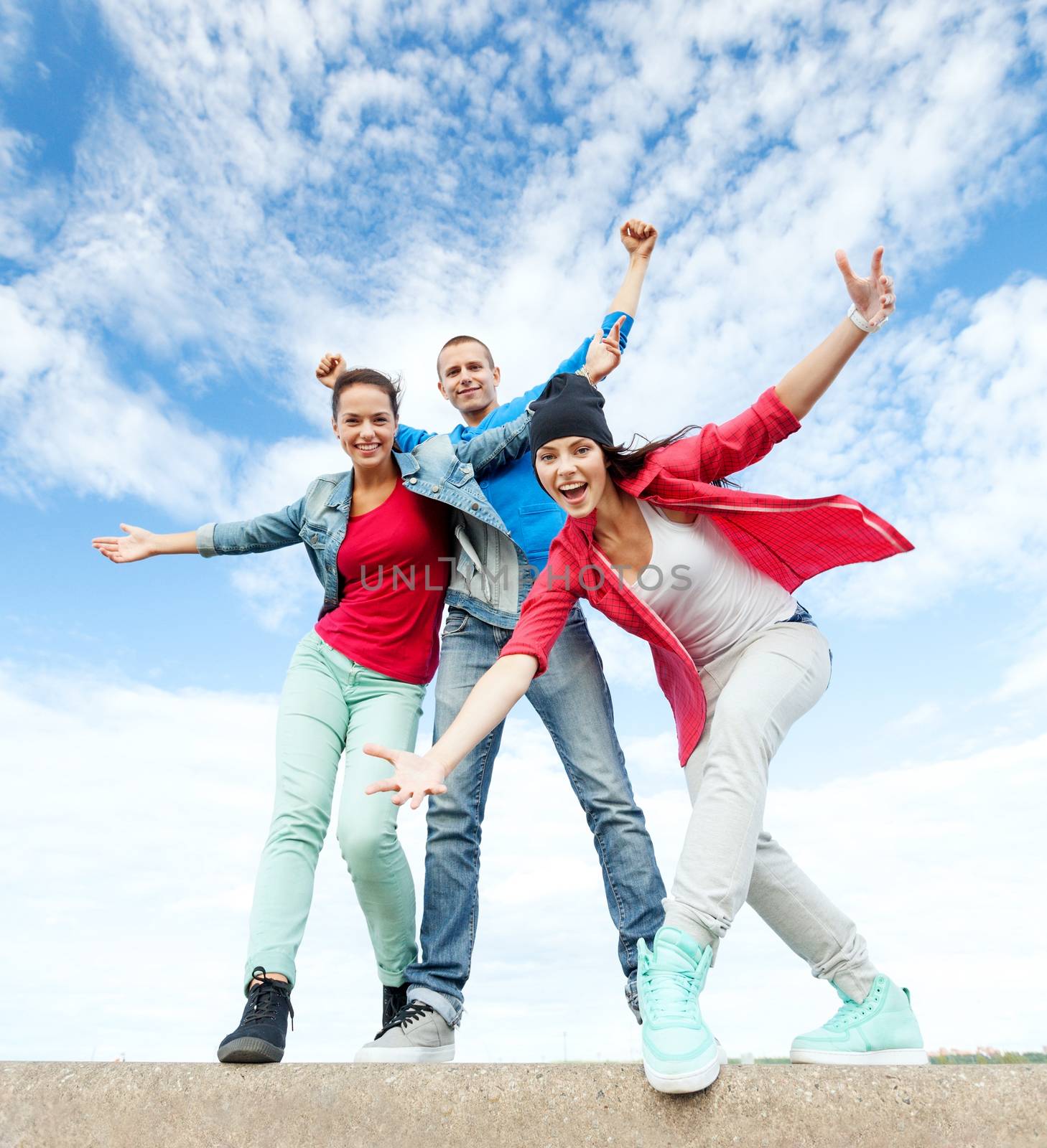 group of teenagers dancing by dolgachov