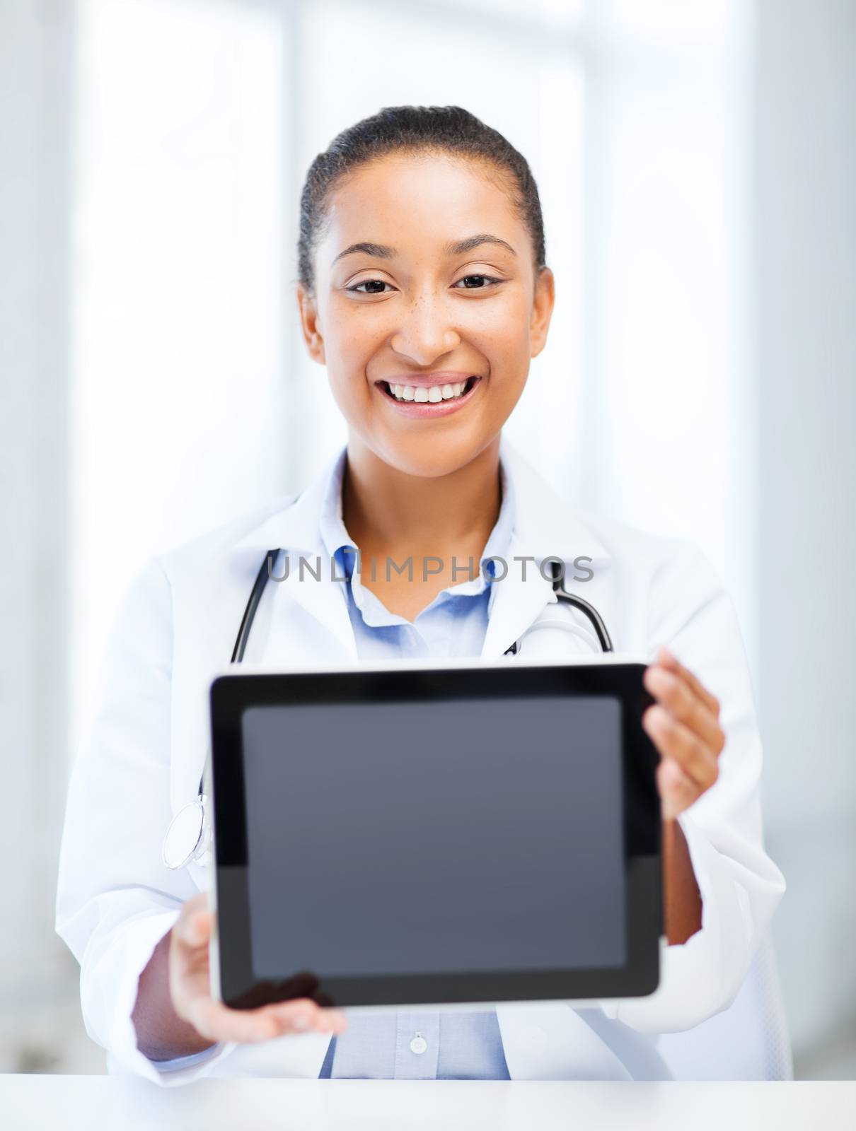 african female doctor with tablet pc by dolgachov