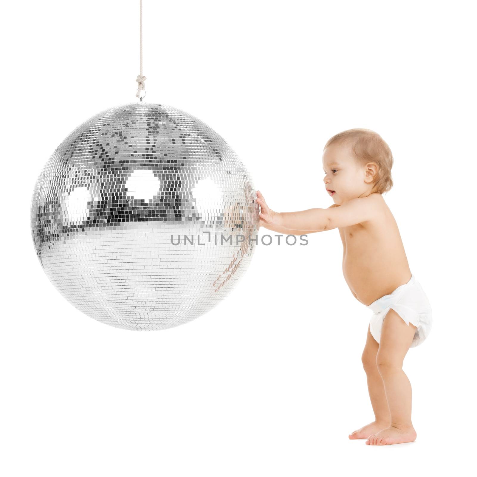 childhood and toys concept - cute little toddler playing with disco ball